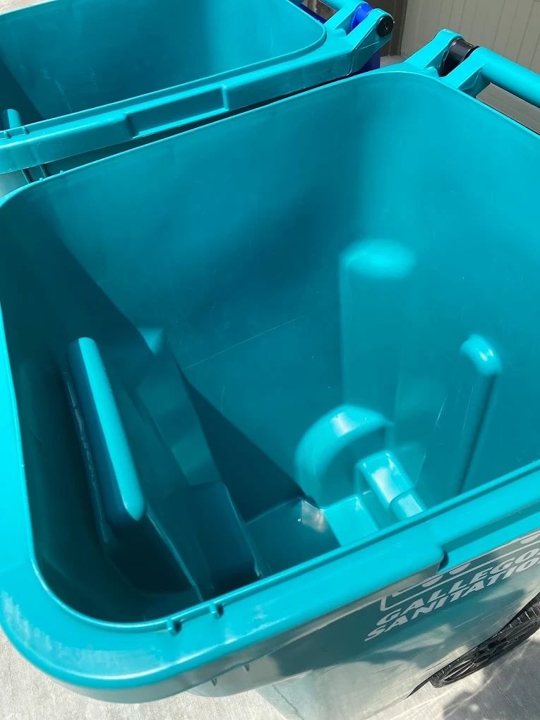Clean turquoise garbage can